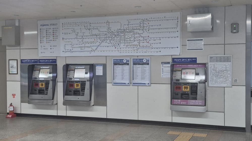 Single journey ticket vending and transit card reload machines in a Seoul subway station